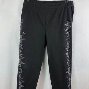 BGL Women’s Black pants with Silver studded skyline on pants size 8.